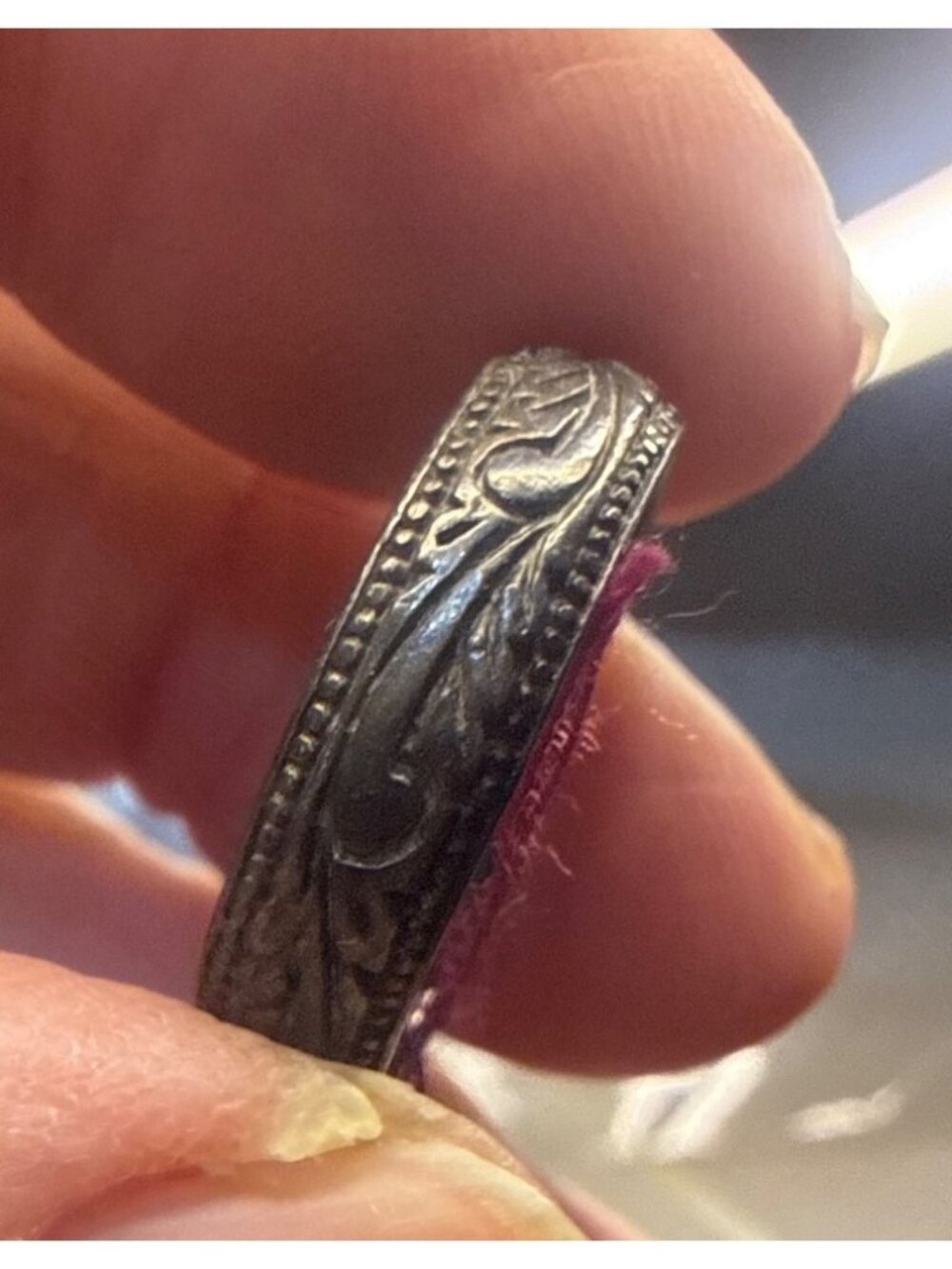 antique sterling silver wedding band features a detailed olive branch engraving